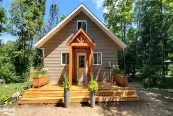 Rear view of property with a wooden deck
