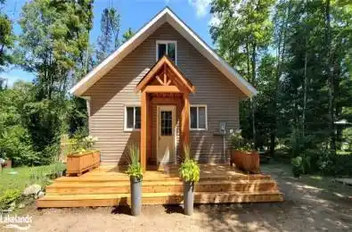 Rear view of property with a wooden deck